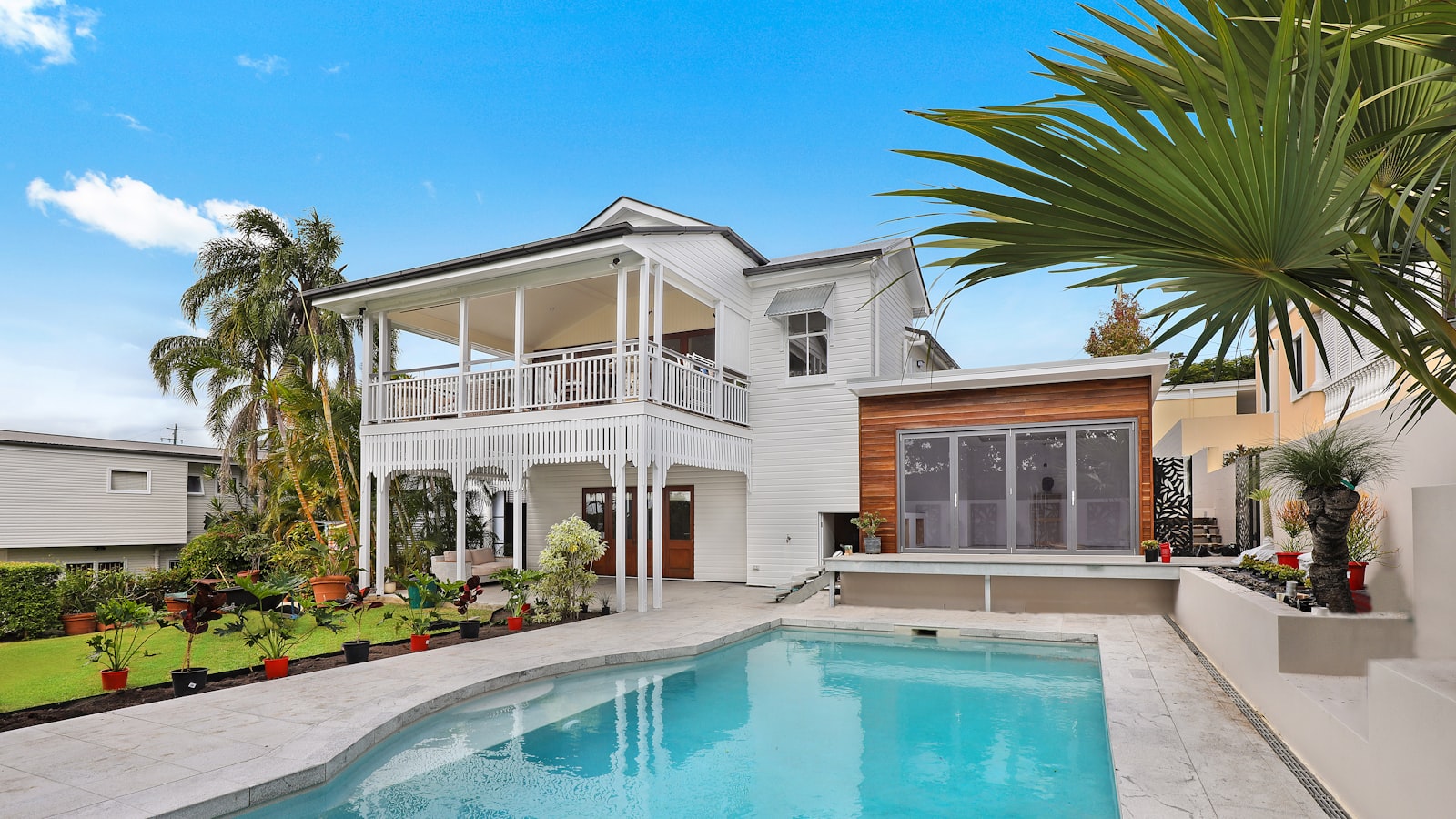 Warm residential exterior with inviting landscaping at golden hour — stock ambiance